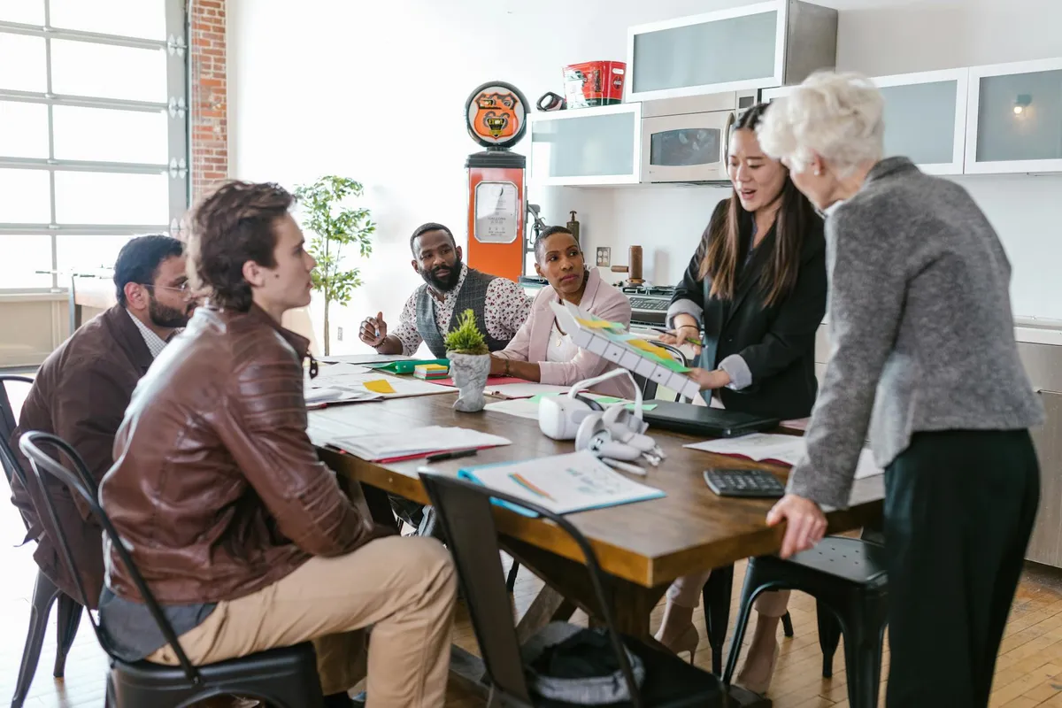 A startup team in a modern office discussing strategy
